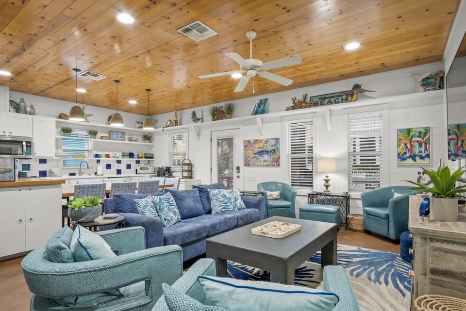 Open-concept living room with large sofas and plenty of natural light.