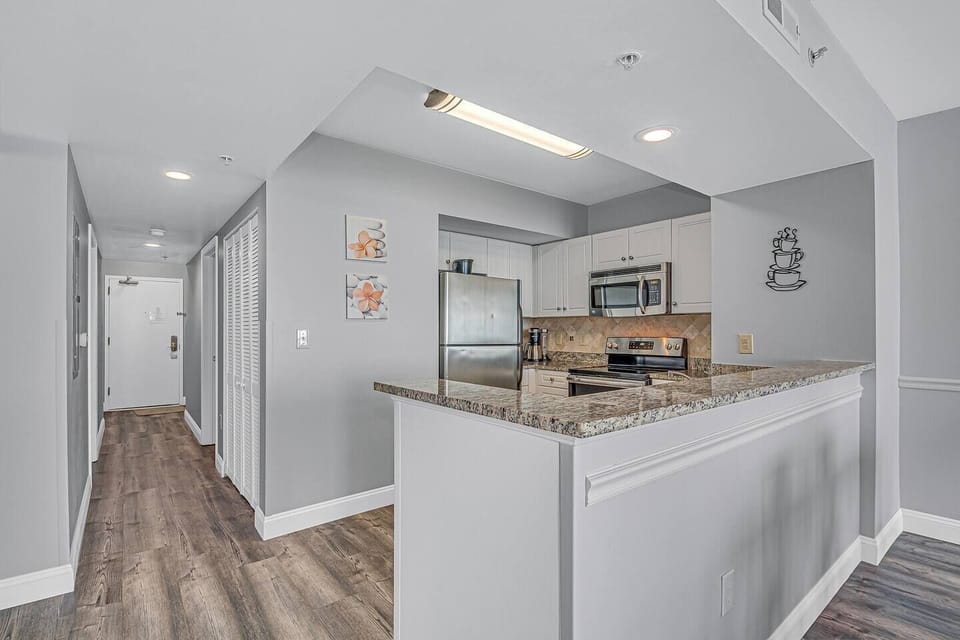 You'll find pleasure in preparing meals in this well-equipped kitchen.