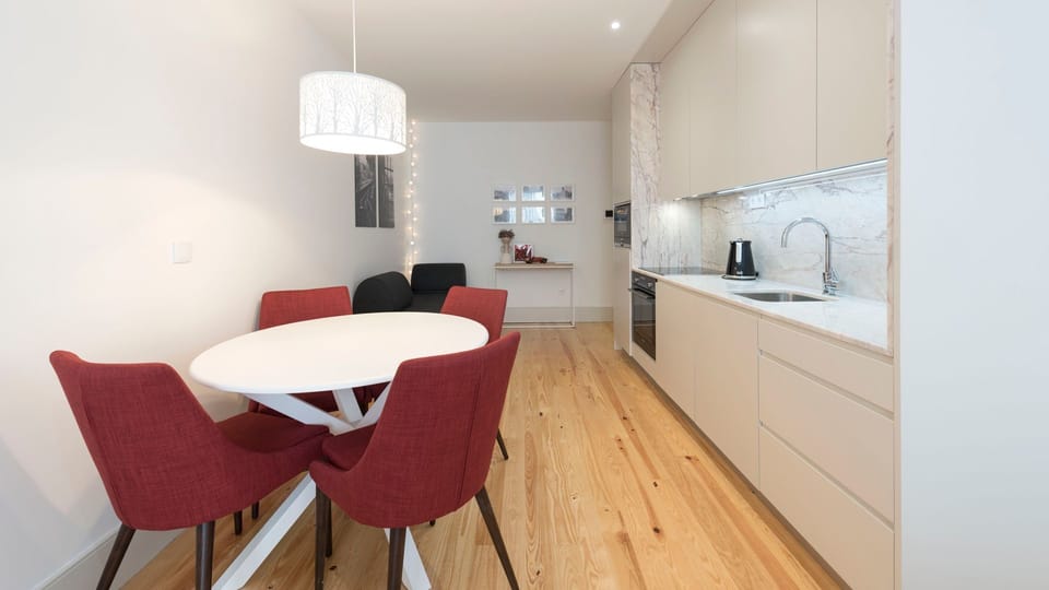 A modern kitchenette + dining area that will provide you with the necessary amenities for a warm and delicious homemade meal #airbnb #airbnbporto #portugal #pt #porto