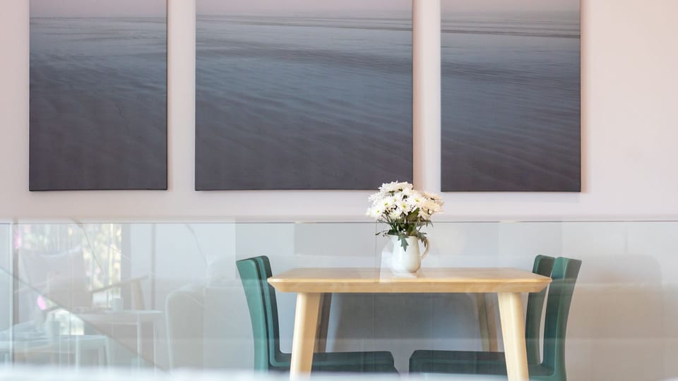 Gather around the inviting dining table, perfect for shared meals and good conversation, bathed in soft, ambient light.
#DiningArea #ModernDecor #LovelyStay
