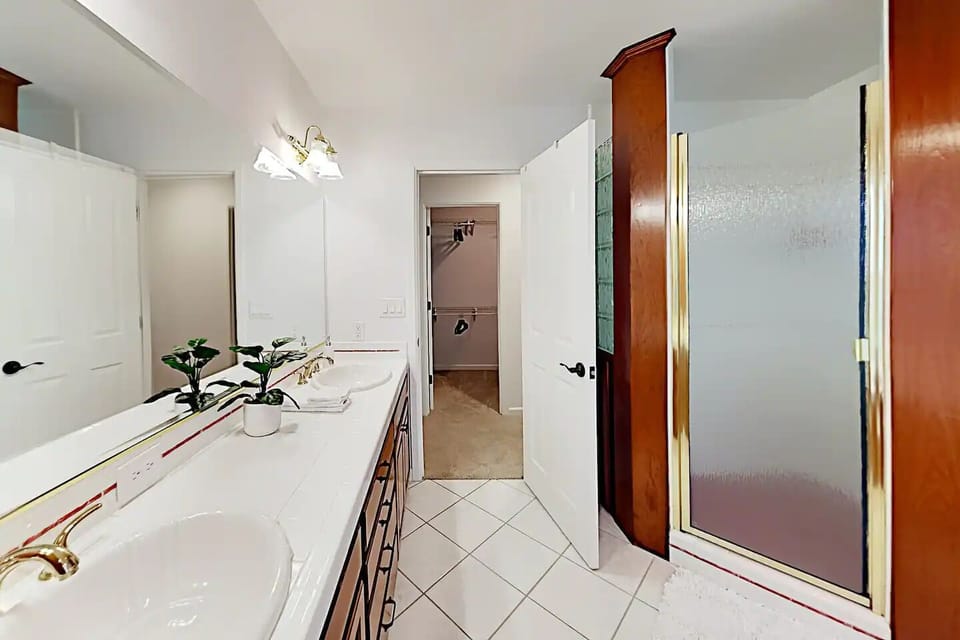 Master bathroom with walk-in shower and dual vanity 