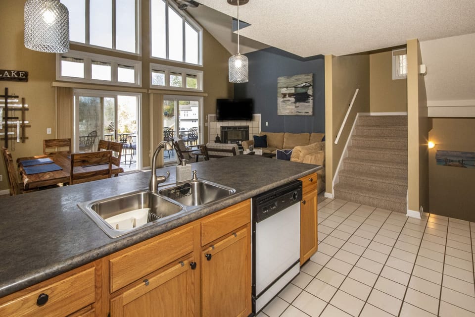 View from the kitchen with stairs up to Ensuite #1 and down to common area