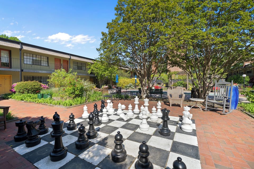 Live chess board in courtyard.