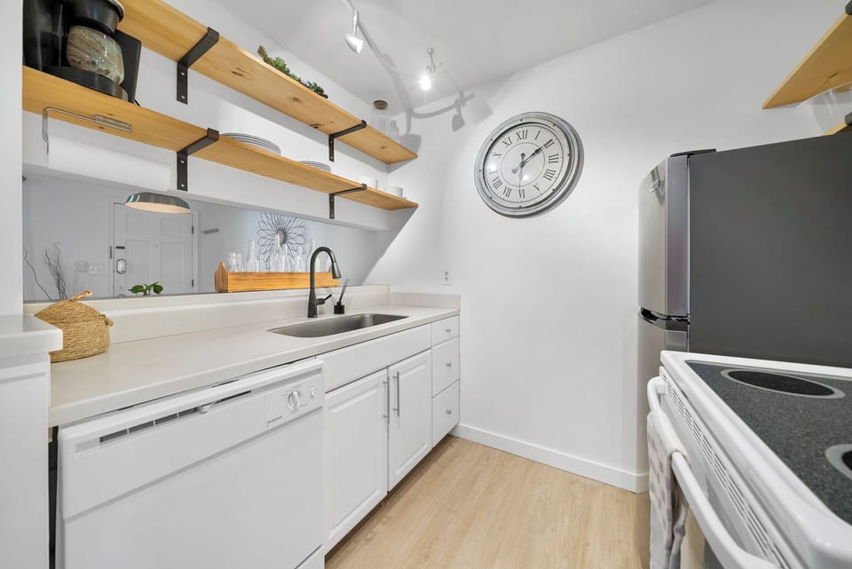 Dishwasher, stove, fridge, microwave and toaster oven.