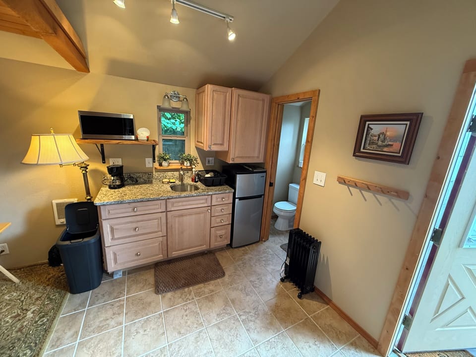 Kitchenette. Bathroom to the right. Front door bottom right photo 