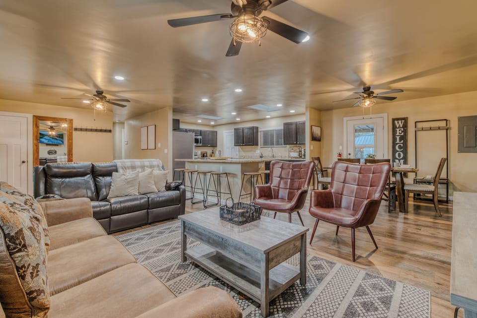 Expansive Living Room – A bright and welcoming living area with plush seating.