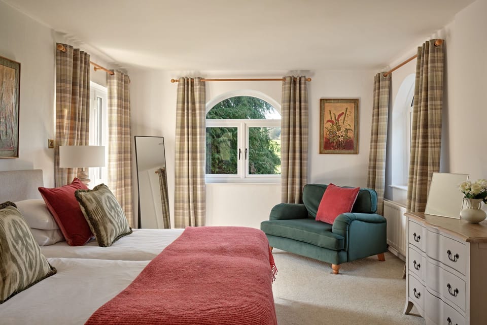 A super-king-size bedroom at Kingfisher Cottage, Welsh Borders