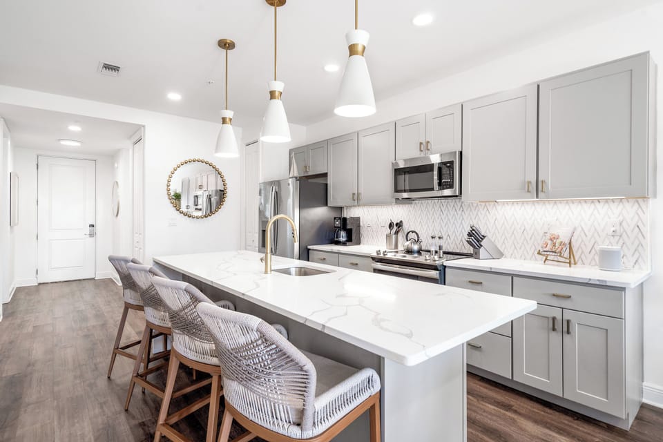 Breakfast bar seating for 4 at the polished kitchen island