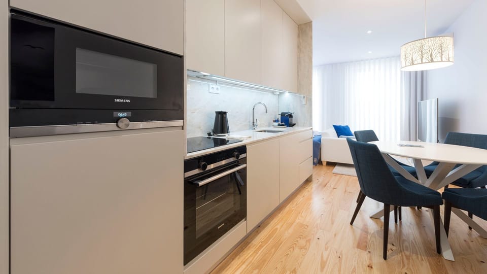 Prepare delicious meals in the sleek, fully equipped kitchen, then enjoy them at the stylish dining table nearby.
#Kitchen #DiningArea #LovelyStay