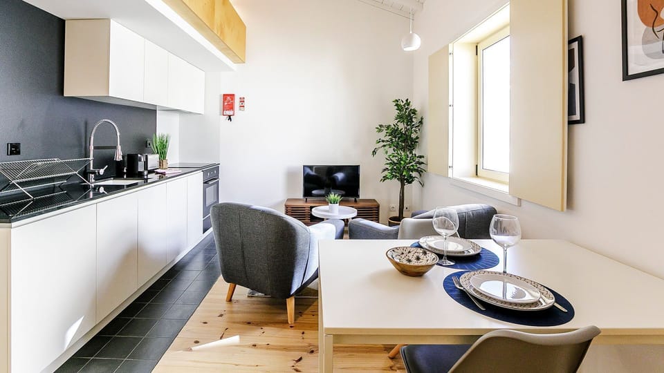 Modern and functional, this open-plan space is designed for effortless living, dining, and relaxing.

#LovelyStay #OpenSpaceLiving #PortoDesign #ComfortFirst