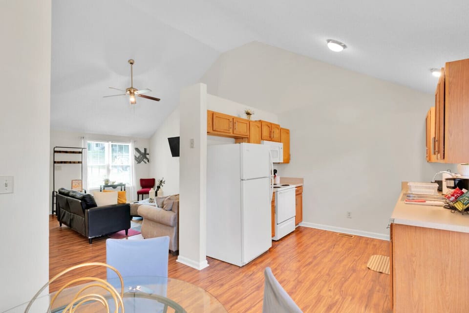 Primary bedroom with comfortable bed and workspace