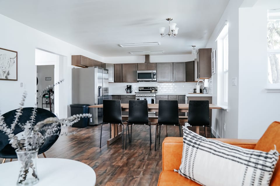 Large, bright, open kitchen, dining and living room space.  Table seating for 9.