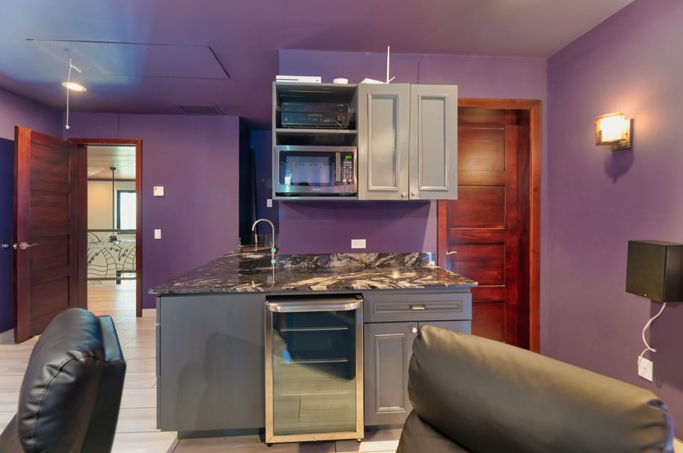 Wet bar and fridge/microwave for movie snacks.