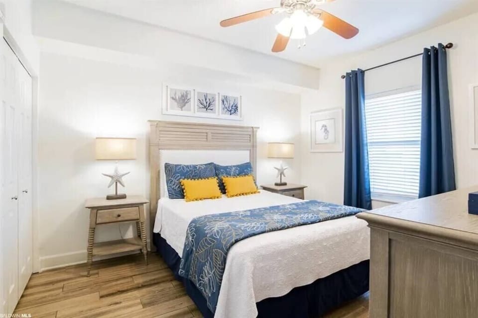 Well decorated secondary bedroom with queen bed.