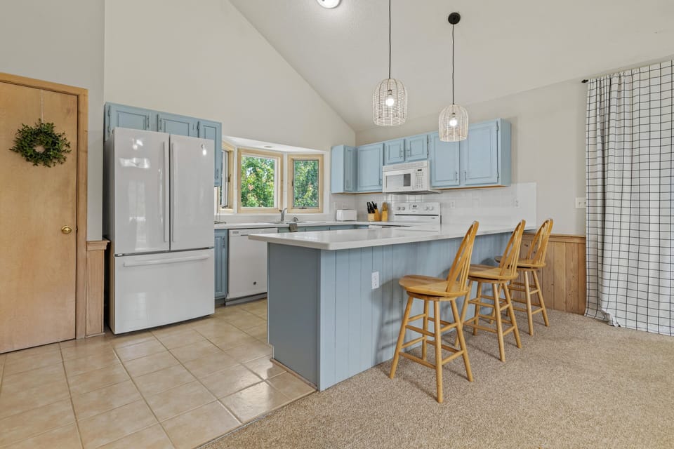 New countertops and refreshed cabinets plus seating for 3 more at the island