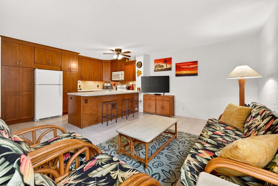 Open layout connects the living area to the kitchen, making it easy to unwind, cook, or spend time together in a relaxed, airy setting.