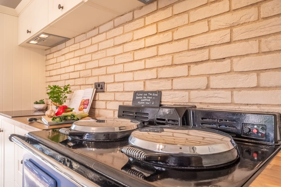 Ground floor: Aga, electric oven and induction hob