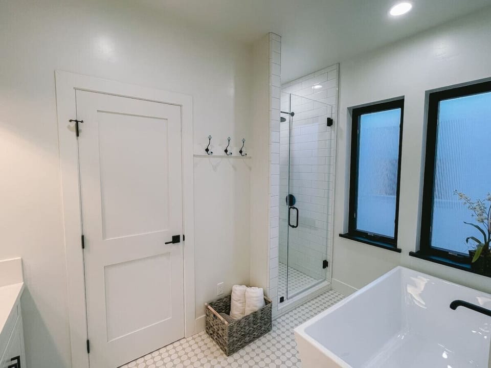 Upstairs en suite bathroom with double vanity bathtub and shower