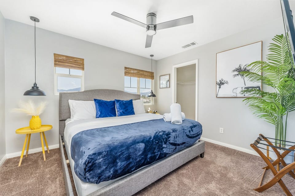 Bedroom with king size bed, hybrid mattress, luxury linens, walk in closet