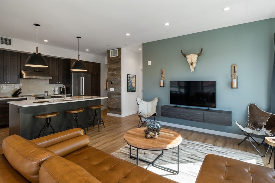 Living room with large flat screen TV.
