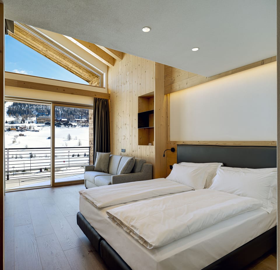 Premium bedding, down comforters, memory foam beds, minibar