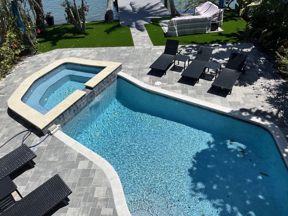 Hot tub seats 10! Waterfall into the pool. 