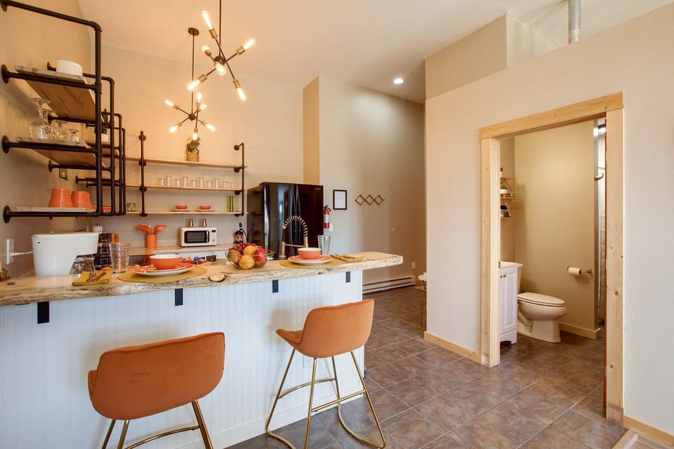 Orange Velvet and gold barstools