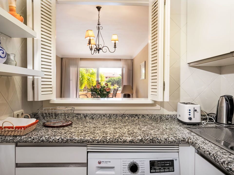 Kitchen, Countertop, Interior Design, Kitchen Appliance, Major Appliance, Cabinetry, Furniture, Plumbing Fixture, Home Appliance, Flooring