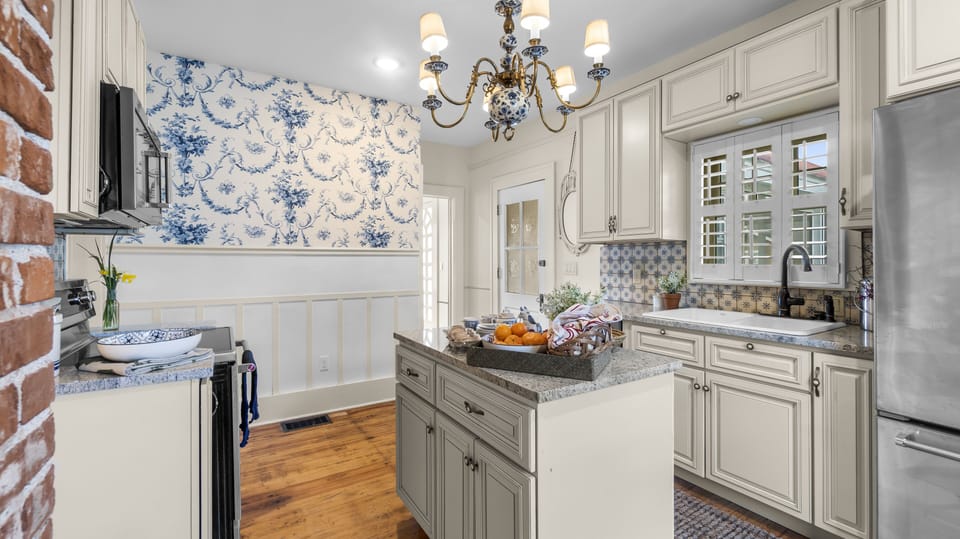 Dutch Delft influence in the Kitchen overlooking a garden out back.