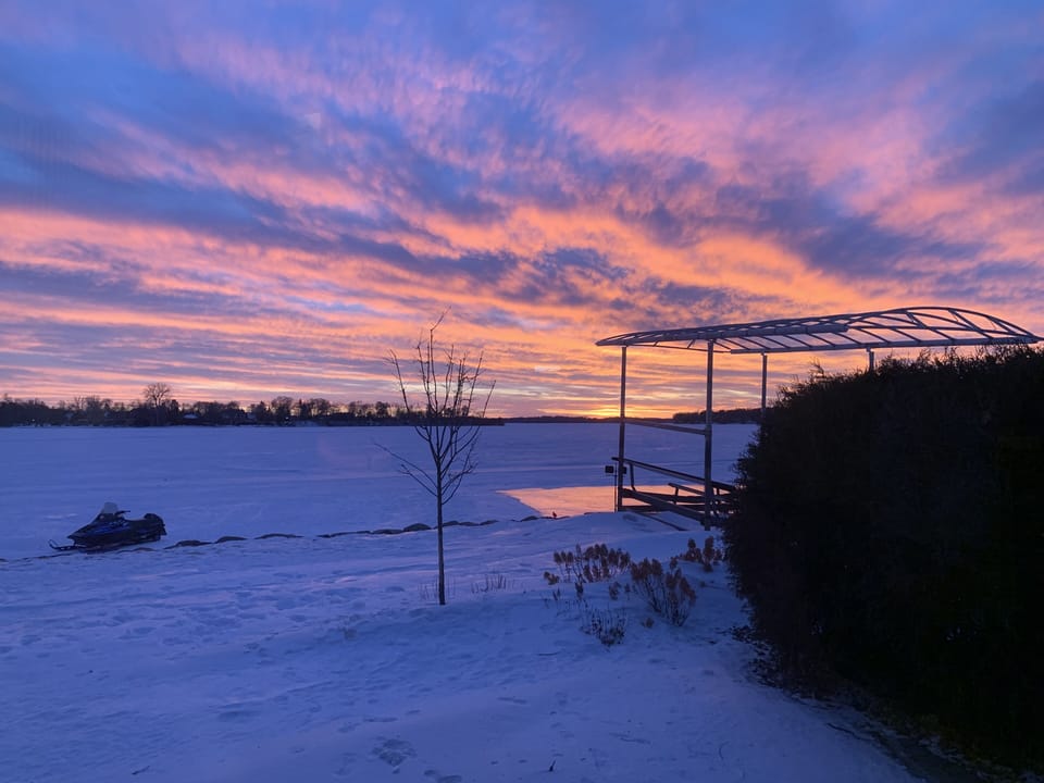 Sunset in the winter - perfect for snowmobiling around the lake 