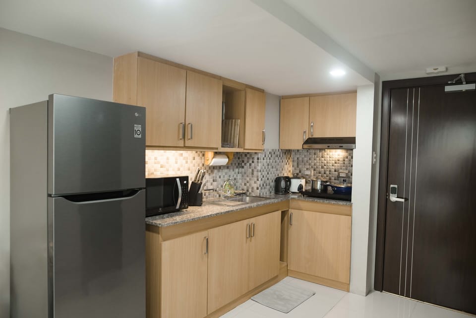 Create culinary delights in the kitchen, complete with a stainless-steel fridge.