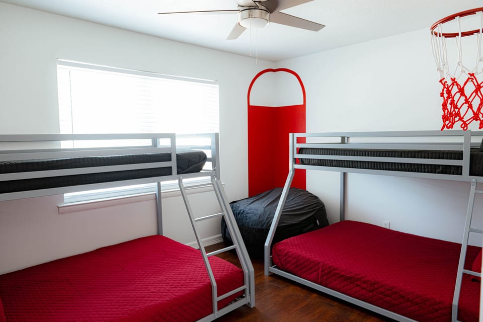 Our basketball inspired room include two bunk beds, comfortably sleeping 4 to 6.