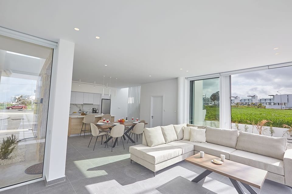 Living room with large patio doors leading to the garden