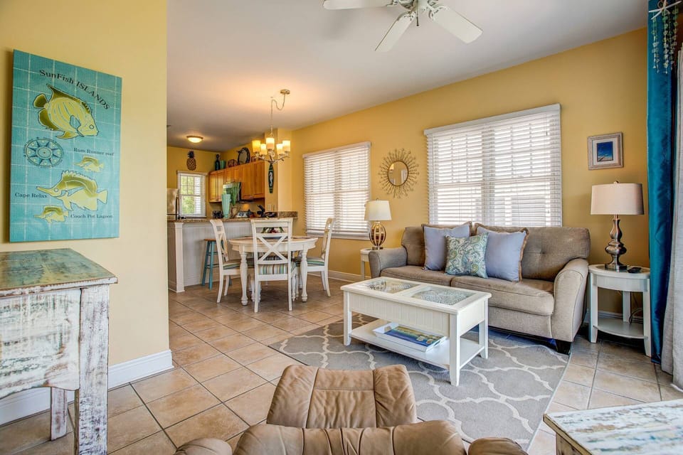 Manatee Bay features an open concept design, allowing an abundance of natural light to flow seamlessly from the living room to the dining area.