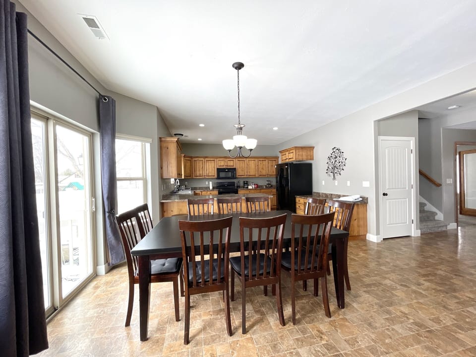 The dining table seats 10 with additional folding tables and chairs available.