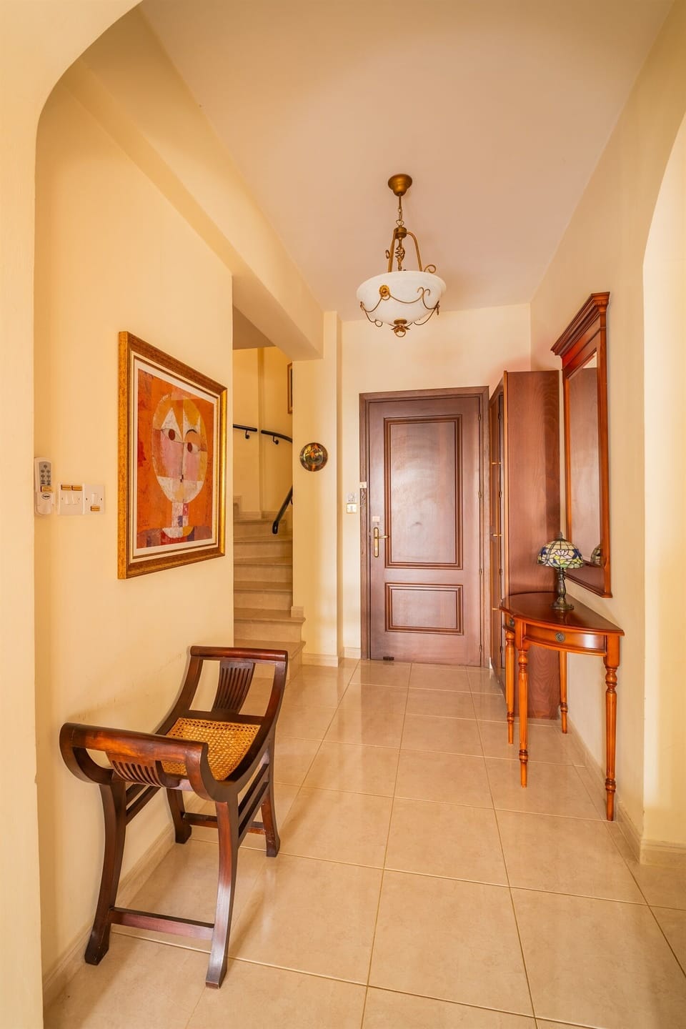 Staircase to the second floor where you find the three bedrooms and the balcony.