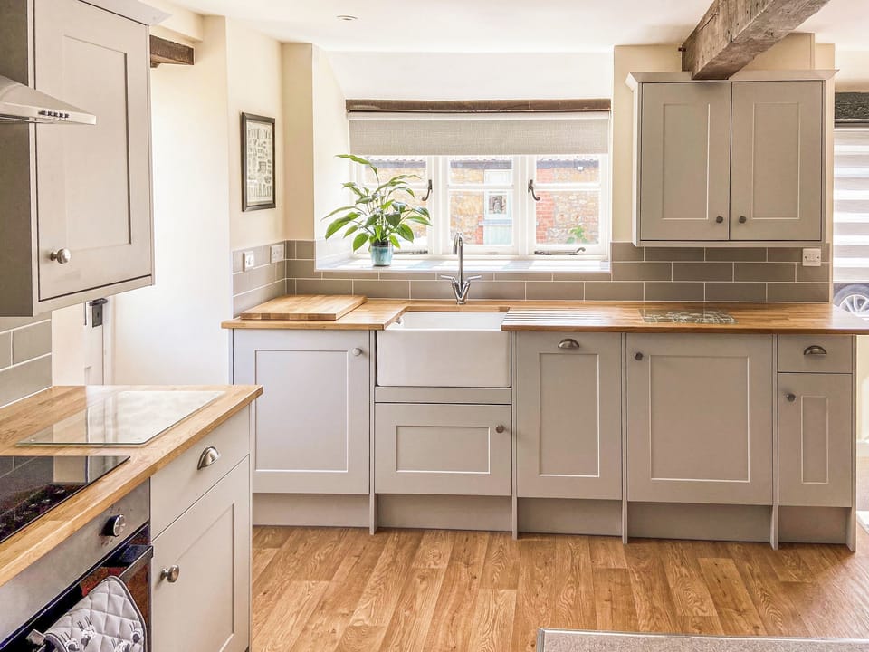 Double bedroom with feature stone walls | The Old Dairy Annexe, Donyatt