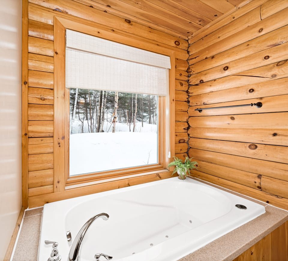 Jetted tub allows for relaxing end to an adventurous day w/ view of golf course.