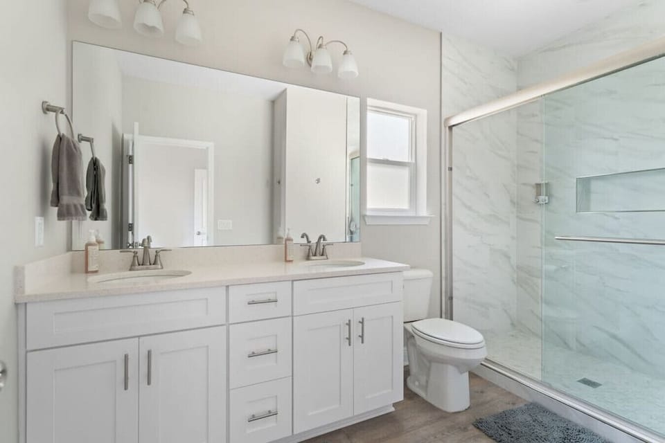 Master bathroom with double vanity and beautiful tiled shower. Attached to master bedroom. High quality soap and shampoo (Everyone for Everybody brand.. no parabens, dyes, phthalates, or artificial fragrance.) Hair dryer available.