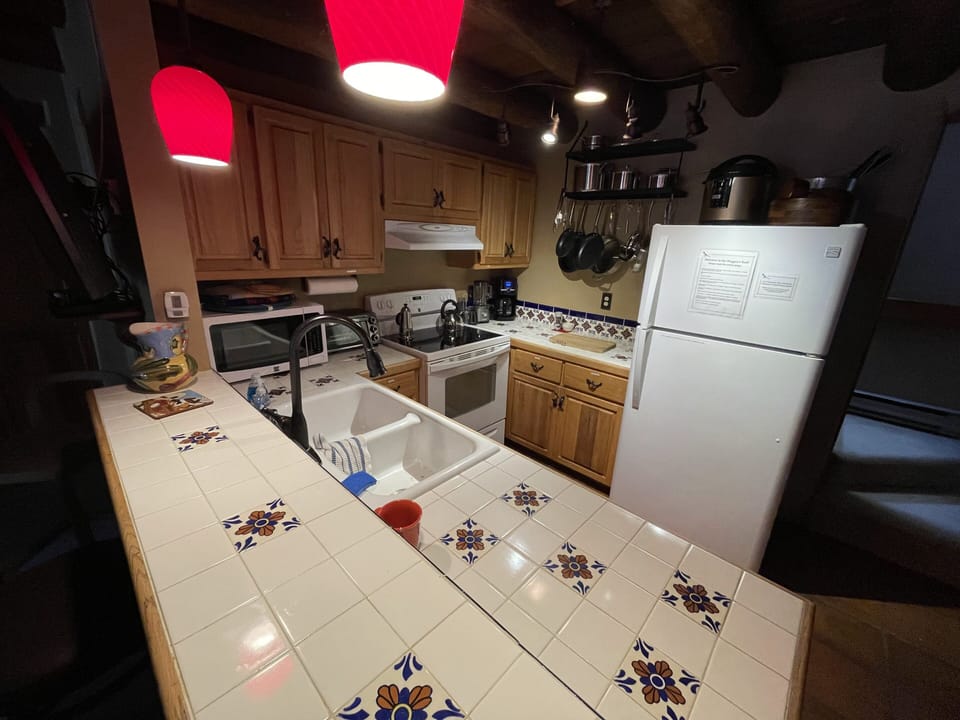 Full kitchen with chef-quality pans, knives, and prep and cooking utensils.