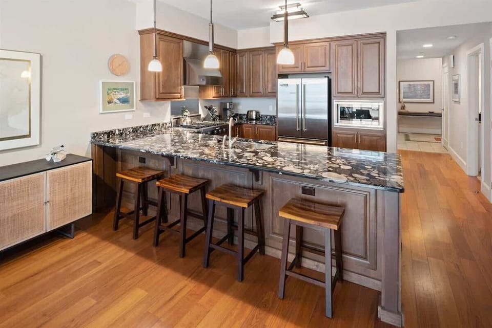 Marble counters and bar seating - luxurious kitchen 