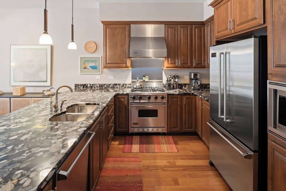 Luxury kitchen with gas cooktop and stainless steel appliances