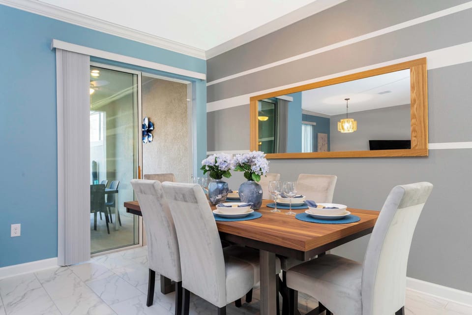 Share special memories in this elegant dining space. The modern striped wall and large mirror add a touch of sophistication to every meal.