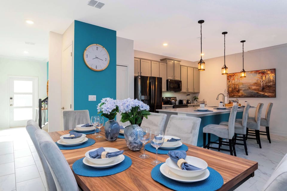Enjoy the seamless flow between the dining and kitchen areas. This open-concept layout is designed for effortless entertaining and family togetherness.