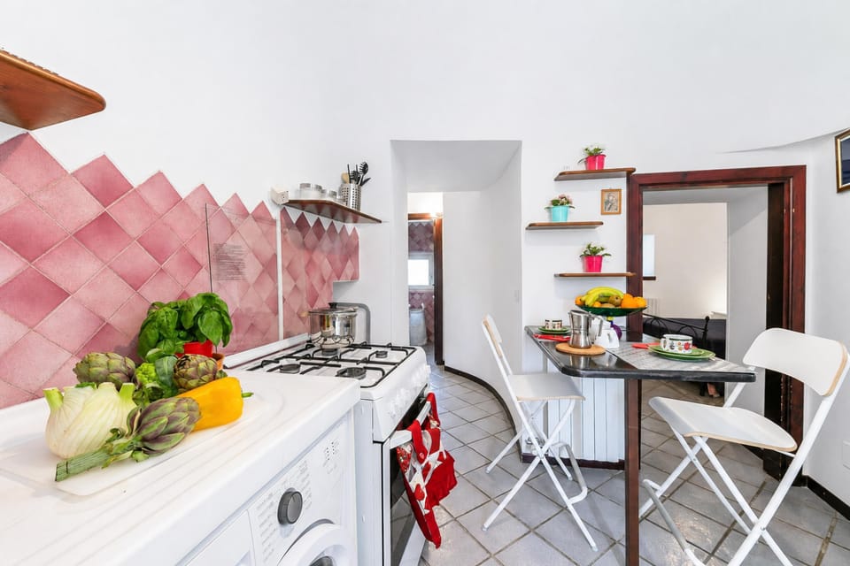 Family Apartment, 2 Bedrooms, Fireplace (La Casa Sulla Roccia Trulli Pool) | Private kitchen | Stovetop, dining tables