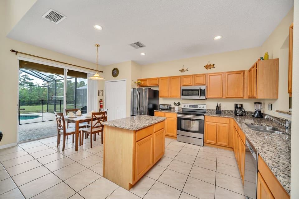 The Full kitchen features granite counter tops and new appliances.