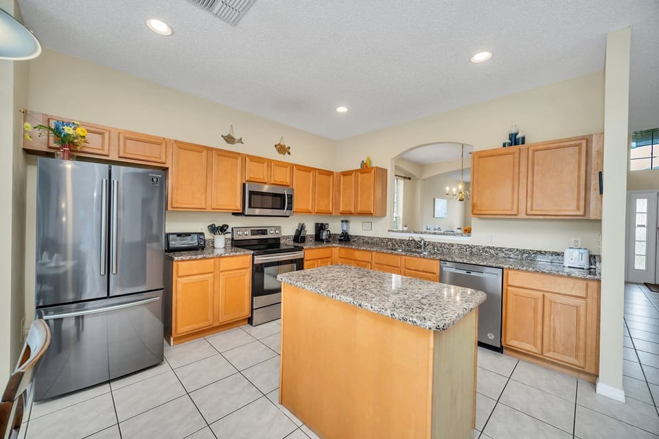 The Full kitchen features granite counter tops and new appliances.