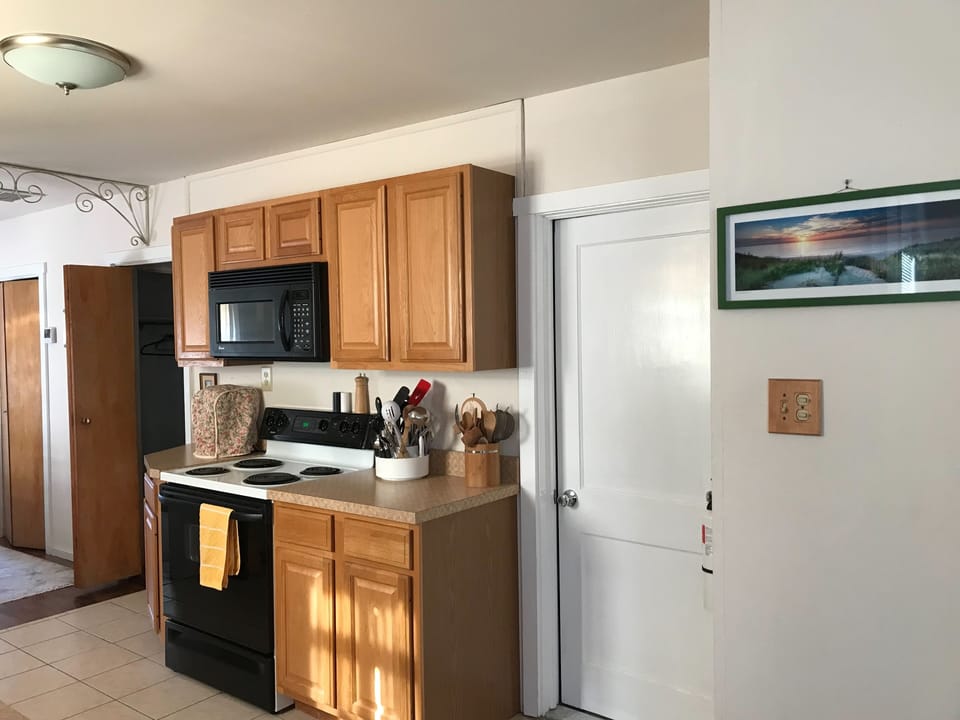 kitchen with dishwasher, coffee maker, toaster 