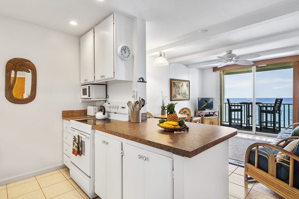 Tastefully updated kitchen with modern appliances and a fresh island-inspired style.