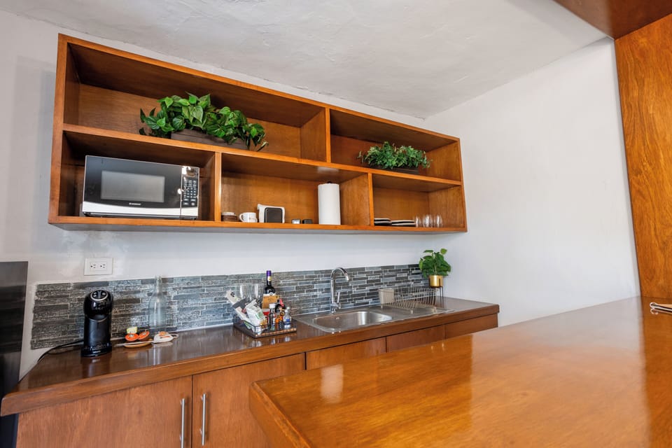 Premium Suite, 1 King Bed with Sofa bed, Refrigerator & Microwave, Pool View | Private kitchen | Espresso maker, highchair, griddle